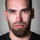 Serious thirty something man on gray background